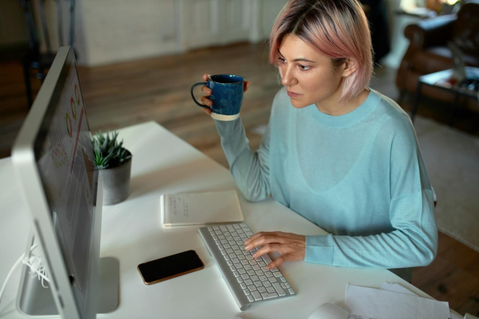 Student reviewing financial documents with visa application materials spread across desk